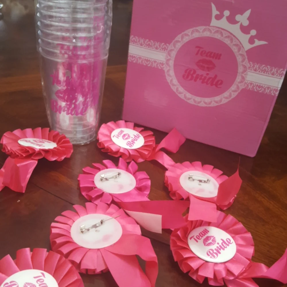 Team bride. Cups and lapel pins.